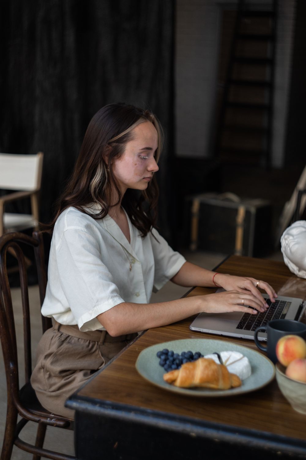 Woman using a laptop at a table