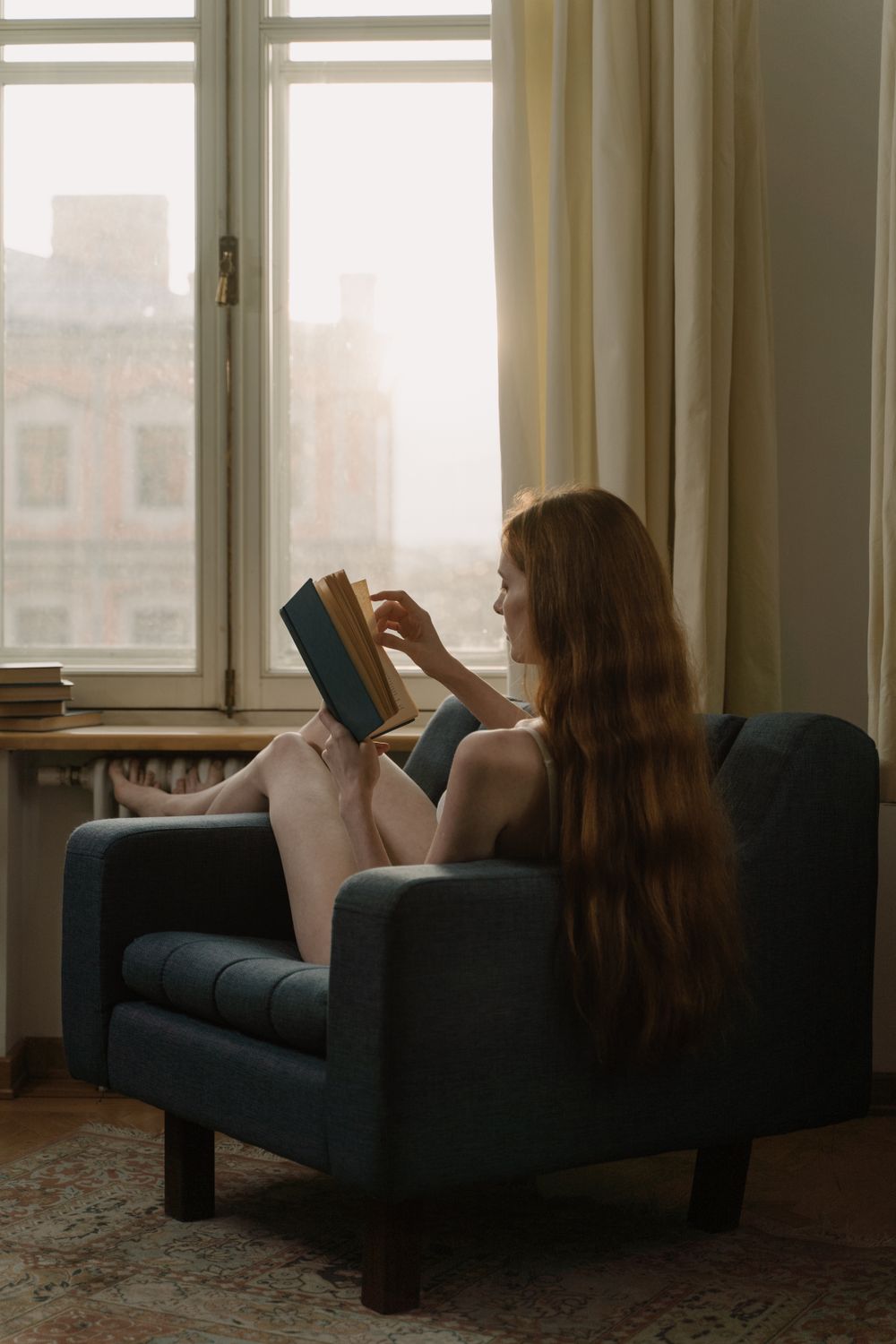 A woman reading on a couch